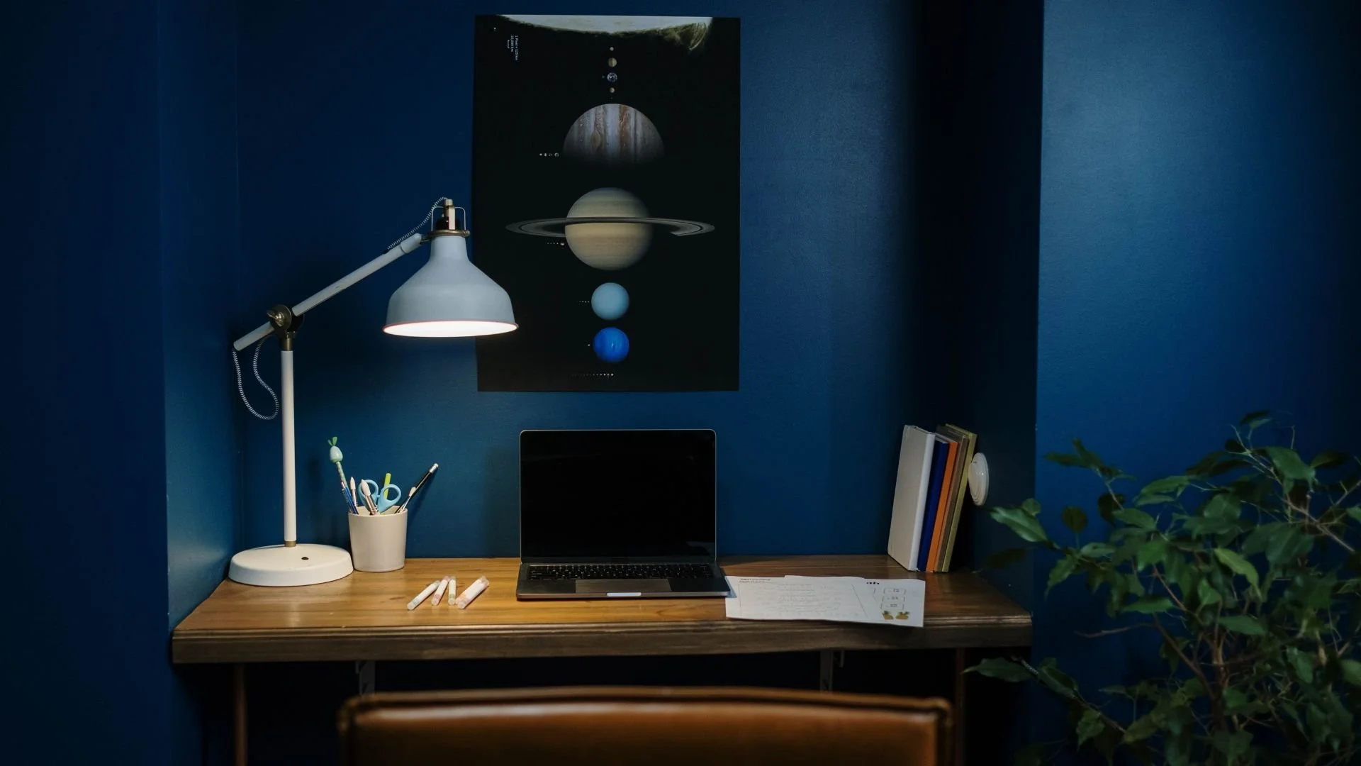 Futuristic remote workspace with blue and mint ambient lighting suggesting balanced work energy